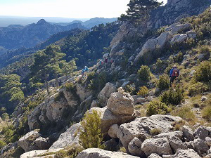 Dropping around crags before the summit