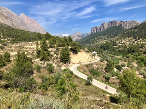Looking up the Arc valley with climbers crags on the right.