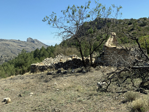 Ascent trail towards Coccoll with ruined finca on LHS
